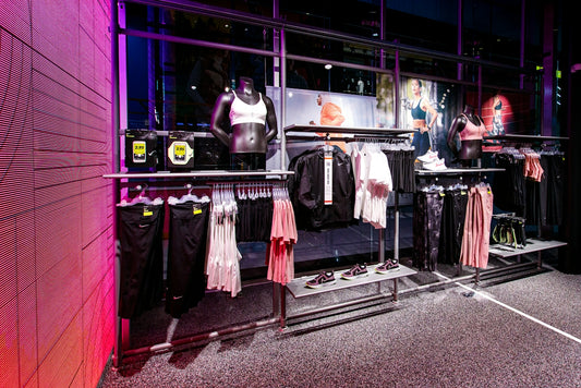 a clothing store display with mannequins and shirts