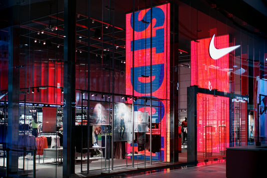 a nike store with red and blue lighting