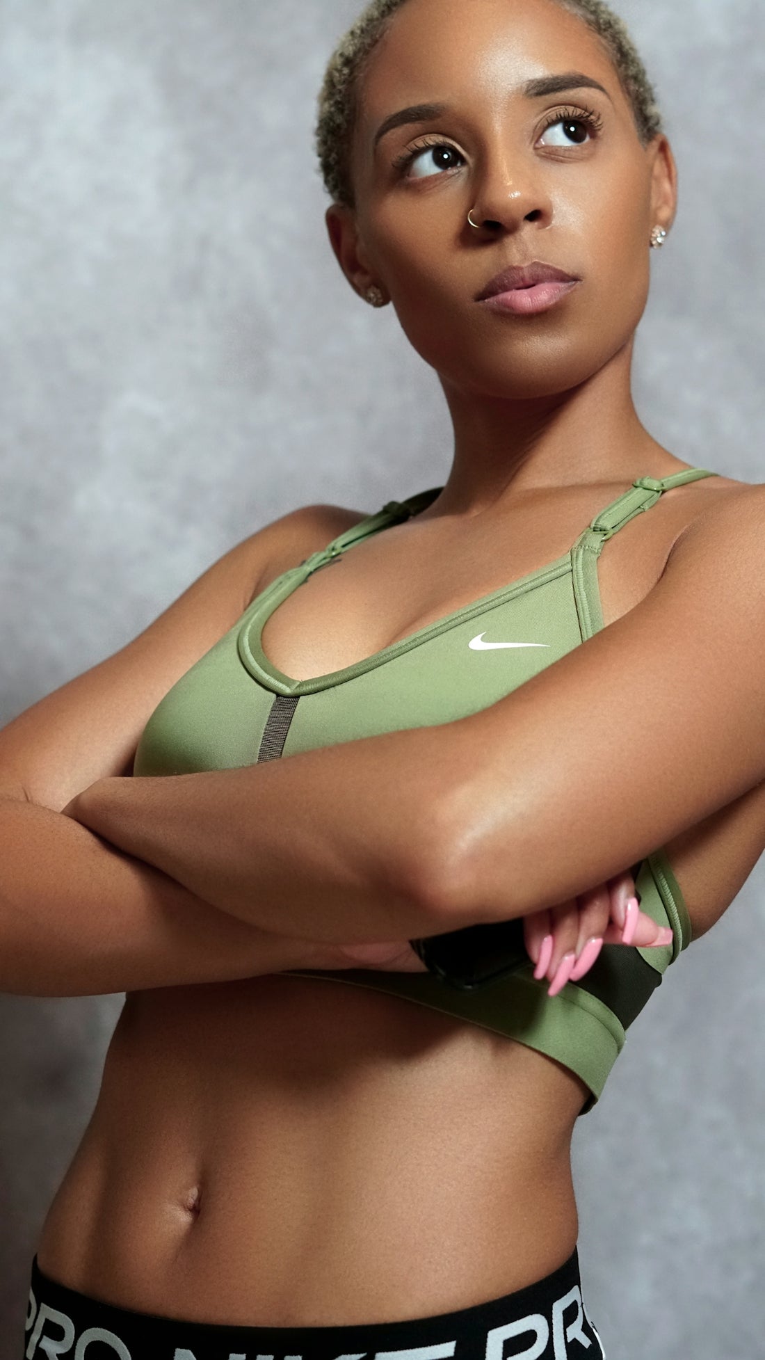 A woman in a sports bra posing for a picture
