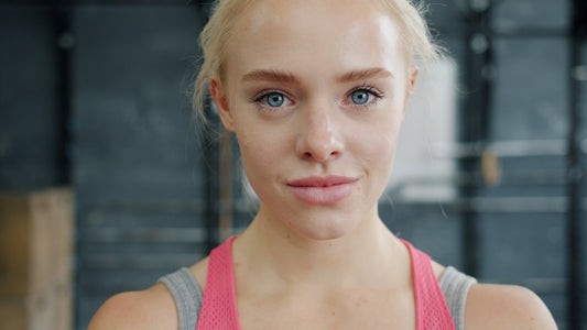 Young woman with blonde hair in gym